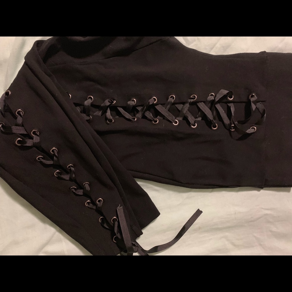 Size 1 black leggings with crisscrossed ties.